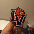 LV Red Bird-badge reel & topper