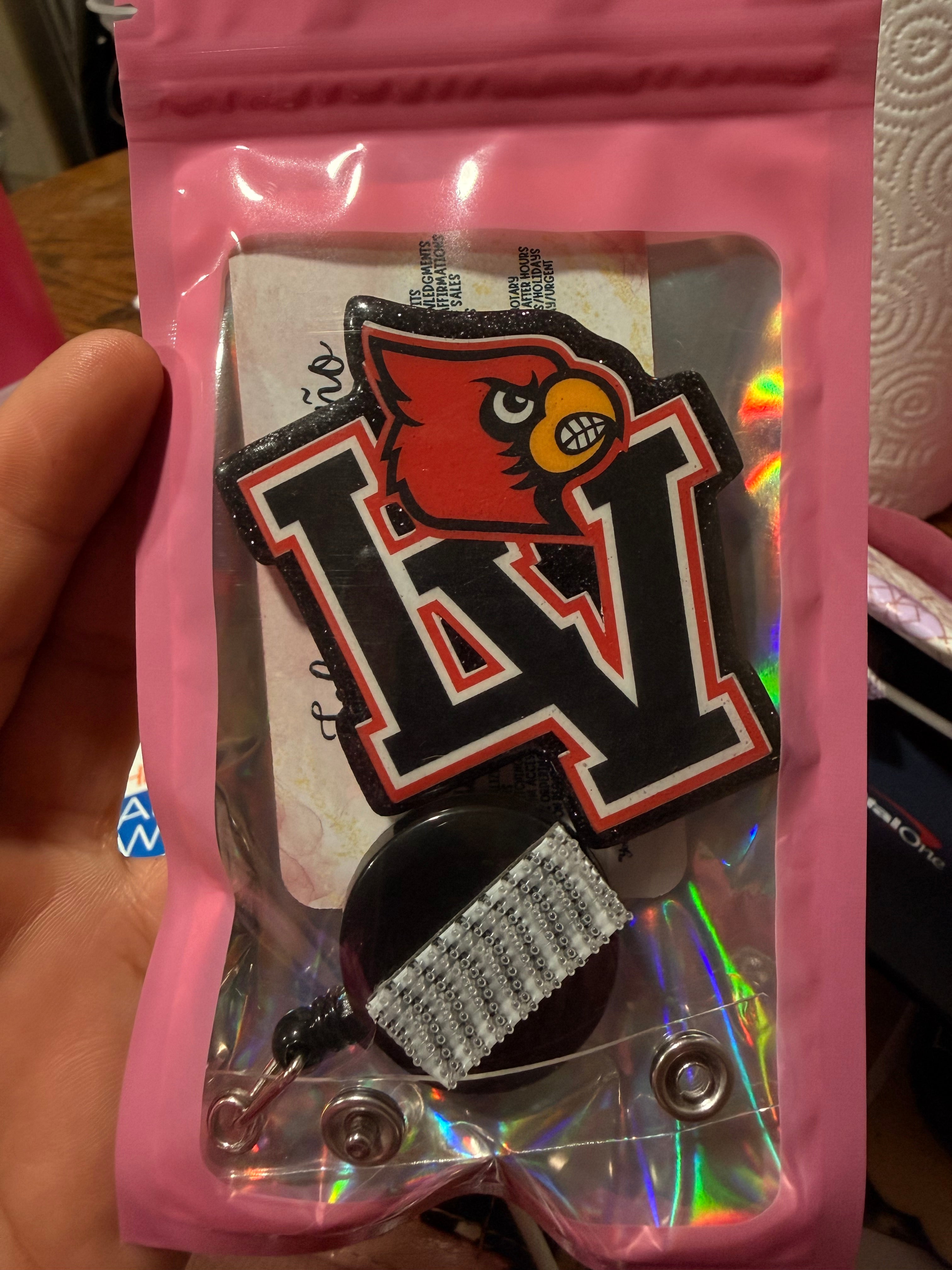 LV red bird-badge reel & topper